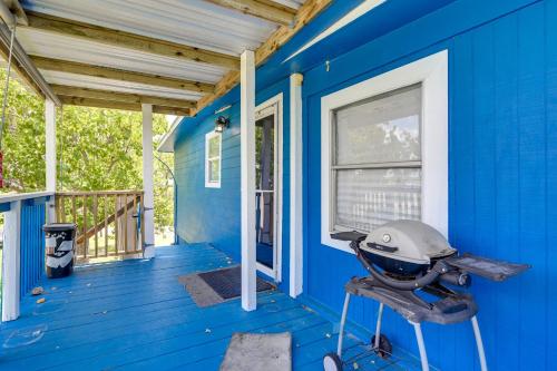 a blue house with a front porch at 2 Mi to Public Beach Pet-Friendly Freeport Home! in Freeport