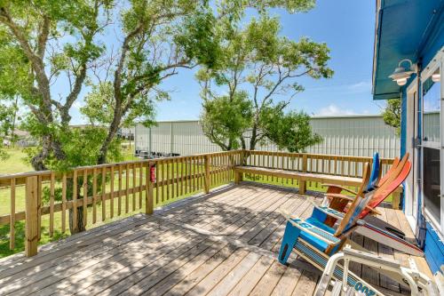 a deck with two chairs and a fence at 2 Mi to Public Beach Pet-Friendly Freeport Home! in Freeport