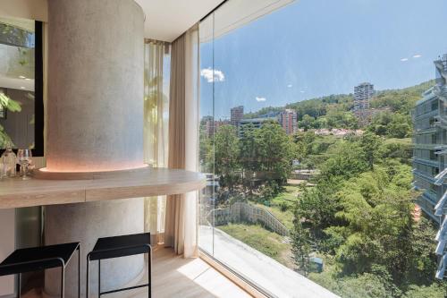 a kitchen with a large window with a view of a city at Seissta Medellín in Medellín