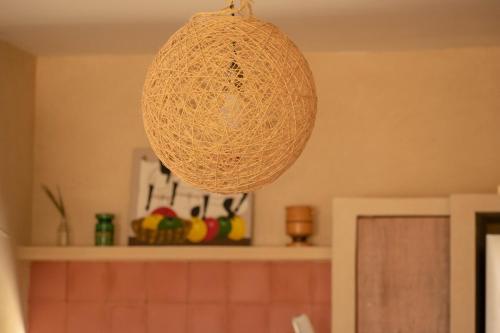 a chandelier hanging from the ceiling in a kitchen at Disfruta en La Casa de Lola / Enjoy at Lolas house in Progreso