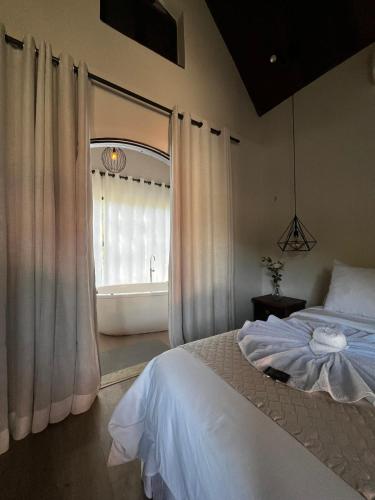 Ένα ή περισσότερα κρεβάτια σε δωμάτιο στο Rancho do Zé João