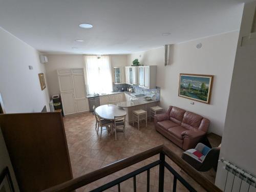 a living room with a couch and a table at Apartment Lemon Tree in La Rocca