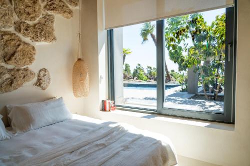 Ένα ή περισσότερα κρεβάτια σε δωμάτιο στο Casa Arim