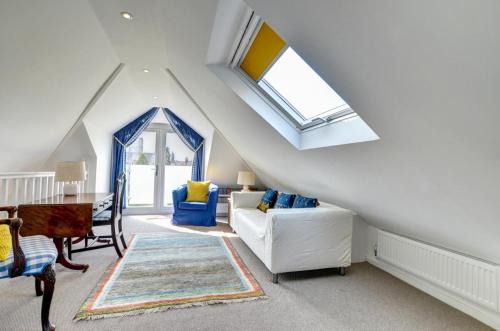a attic living room with a skylight at 6a Springfield Road in Swanage
