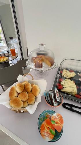 a table with plates of food on a counter at Cefalù Luxury Suite in Cefalù