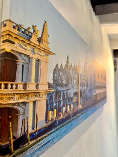 a picture of a building on a wall at Serenity in Venice