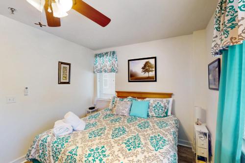a bedroom with a bed and a ceiling fan at The Pointe - Serenity Shores - 3204 in Huddleston
