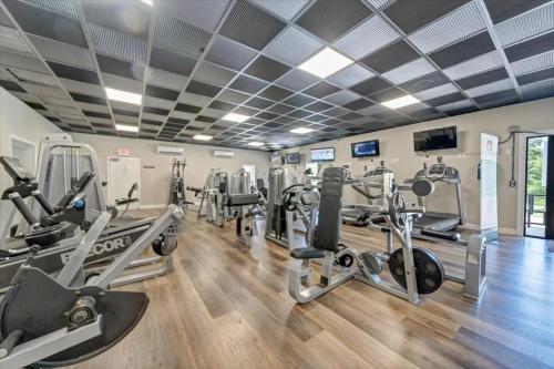 a gym with treadmills and elliptical machines at The Pointe - Serenity Shores - 3204 in Huddleston