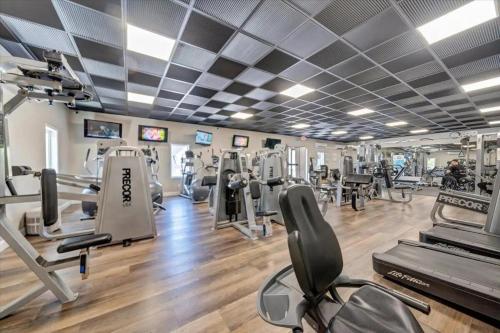 a gym with treadmills and elliptical machines at The Pointe - Serenity Shores - 3204 in Huddleston