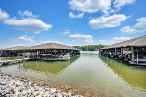 a group of buildings on a river with water at The Pointe - Serenity Shores - 3204 in Huddleston