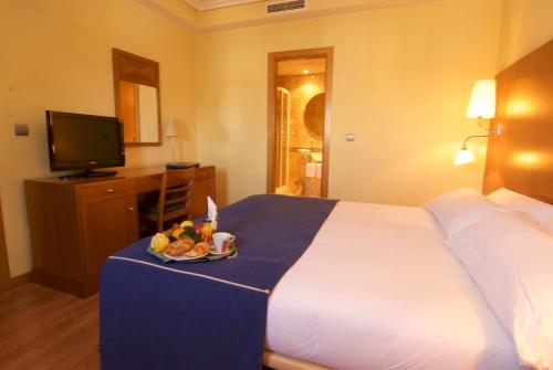 Postel nebo postele na pokoji v ubytování Hotel Galaico
