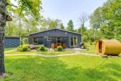 a tiny house in a yard with a tree at Family Home with Outdoor Oasis in Hudson Valley in High Falls