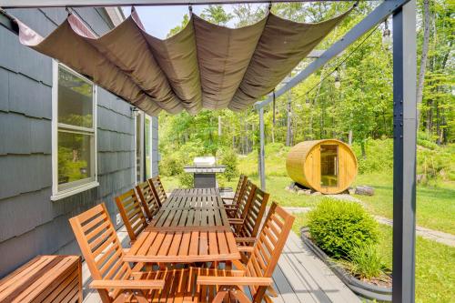 a patio with a table and chairs and a tent at Family Home with Outdoor Oasis in Hudson Valley in High Falls