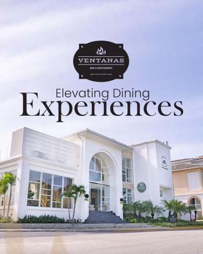 a building with a sign that reads engineering dining experiences at Cana Cove in Punta Cana
