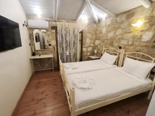Ένα ή περισσότερα κρεβάτια σε δωμάτιο στο Artemis Luxury Villa