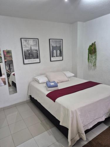 Postel nebo postele na pokoji v ubytování Apartaestudios Zona Norte Vipasa Cali
