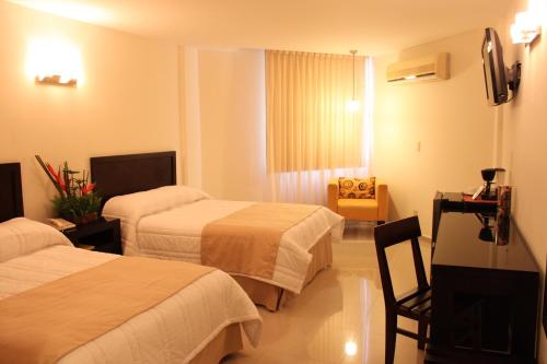 Ein Bett oder Betten in einem Zimmer der Unterkunft Hotel Mesón de la Chinantla