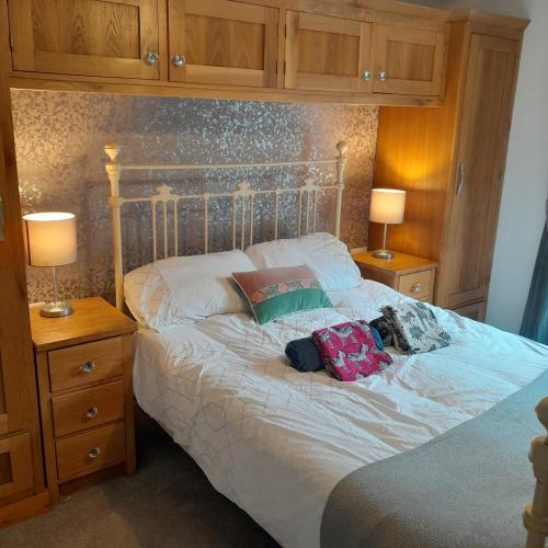 a bedroom with a bed with two bags on it at Forest view in Ballycassidy
