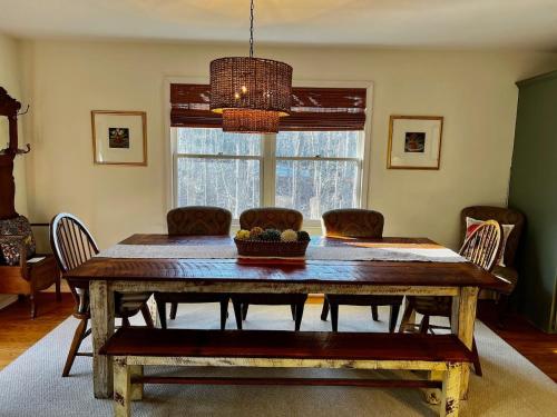 a dining room with a wooden table and chairs at Rabbits Run-Mountain Creek Retreat in Mentone