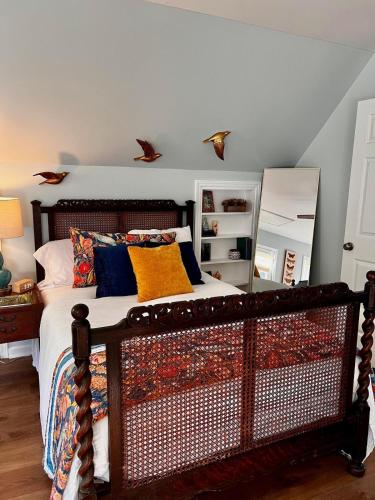 a bedroom with a bed with a mirror on the wall at Rabbits Run-Mountain Creek Retreat in Mentone