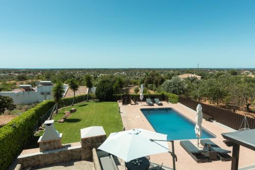 a villa with a swimming pool and a view at Casa Do Vale - Algarve in Vargem da Mão