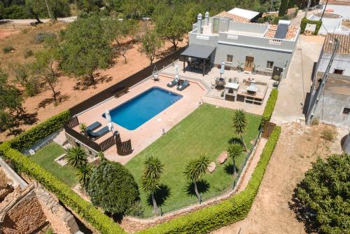 an aerial view of a house with a swimming pool at Casa Do Vale - Algarve in Vargem da Mão