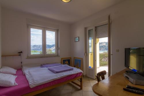 Ένα ή περισσότερα κρεβάτια σε δωμάτιο στο Apartments OK