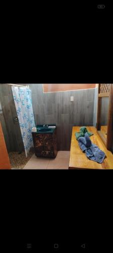 a bathroom with a table with towels on it at Cabañas Ángela in Mazamitla