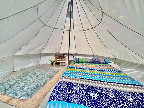 Postel nebo postele na pokoji v ubytování Glamping Vive Tlaxcala - Santuario de las luciérnagas