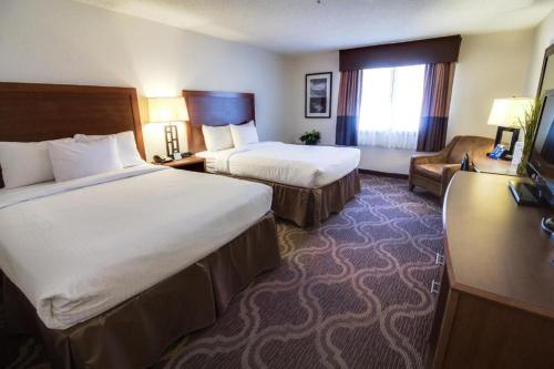 Postel nebo postele na pokoji v ubytování Ashmore Inn and Suites Lubbock