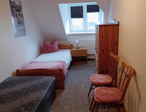 Un pat sau paturi într-o cameră la Ferienwohnung Christine Nestler