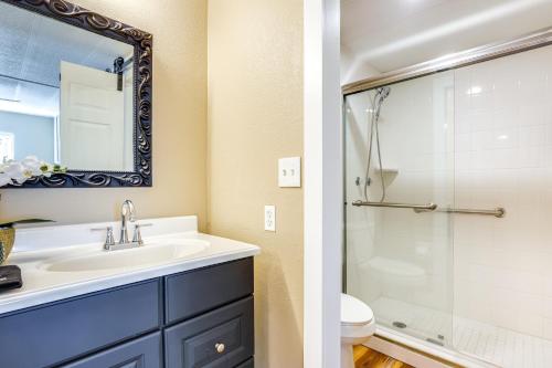 a bathroom with a sink and a shower at Lakefront Home with Hot Tub and Dock in Orlando! in Orlando