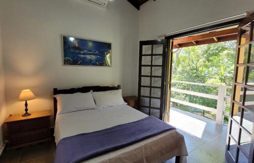 Postel nebo postele na pokoji v ubytování Casa Aconchegante na Praia de Paúba