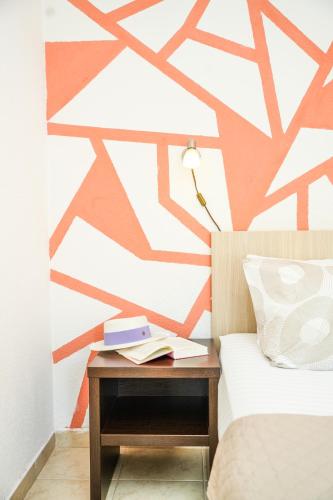a bedroom with a bed with a table with a lamp at Apartments Bućin in Kotor