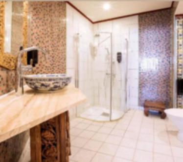 a bathroom with a sink and a shower in it at Oneness Nordic 