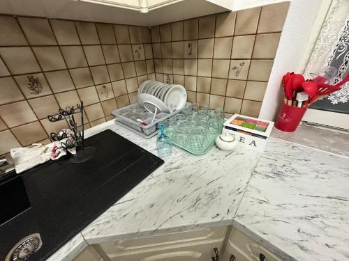 a bathroom with a sink and a counter top at Easy Stay Room for Two in Nürnberg