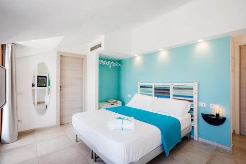 a blue and white bedroom with a bed at Casa Clementina Marciano in Massa Lubrense