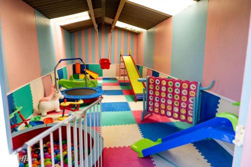 a play room with a bunch of toys in it at Spacious Farmhouse Retreat with Hot Tub, sleeps 12 in Llawhaden