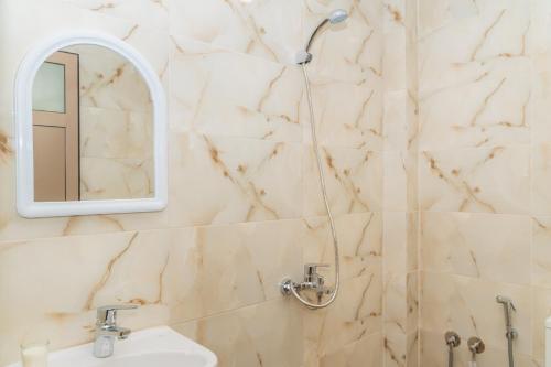 a bathroom with a sink and a mirror at Tifawine Stay Guest House Social Stay and Oceanview Rooms in Imsouane