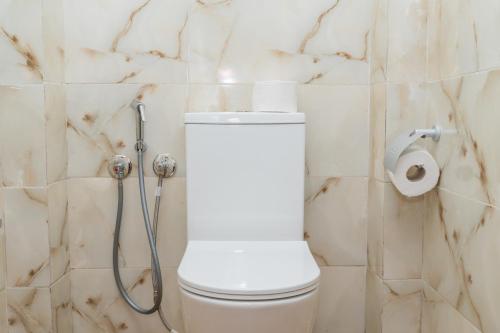 a bathroom with a toilet and a shower at Tifawine Stay Guest House Social Stay and Oceanview Rooms in Imsouane