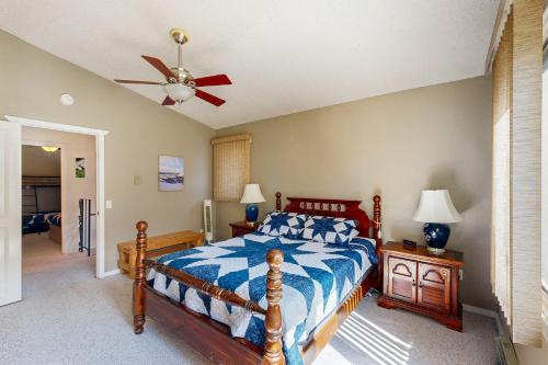 a bedroom with a bed and a ceiling fan at Brighton Condo #209 in Girdwood