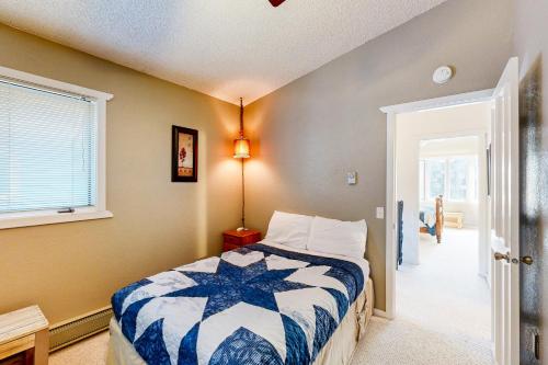 a bedroom with a bed and a window at Brighton Condo #209 in Girdwood