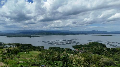 an aerial view of a lake on a cloudy day at Wonogiri Rocks in Tempuran
