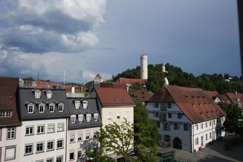a group of buildings in a town with a tower at Ferienwohnungen Vito's Apartments Ravensburg in Ravensburg