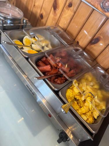 a buffet with many different types of food on a table at Hotel LIDI in Sarandë