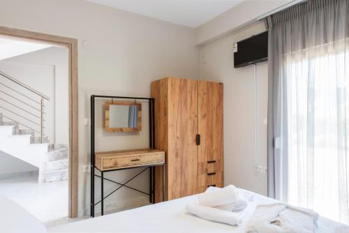 Ένα ή περισσότερα κρεβάτια σε δωμάτιο στο Eunoia Luxury Villas