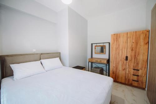 Ένα ή περισσότερα κρεβάτια σε δωμάτιο στο Eunoia Luxury Villas
