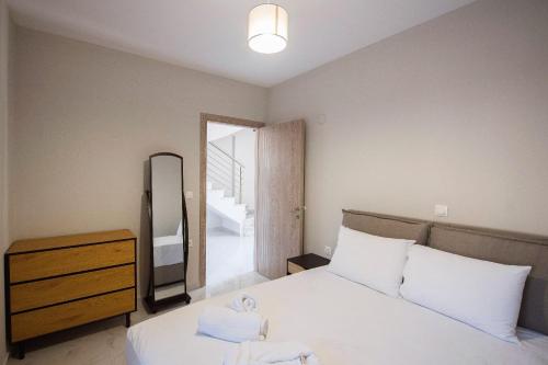 Ένα ή περισσότερα κρεβάτια σε δωμάτιο στο Eunoia Luxury Villas