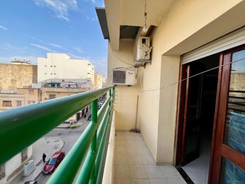 a balcony of a building with a view of a street at Fes Central Studio - Prime Location & Practical in Fès