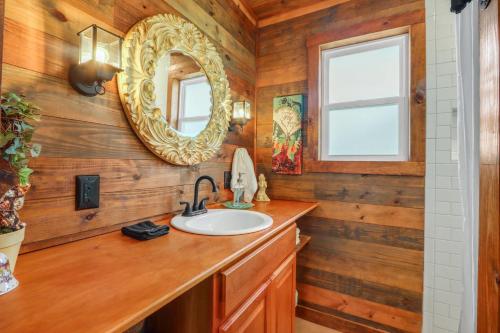 a bathroom with a sink and a mirror at RusTx Ranch Unit 7- Music in Wimberley